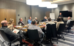 The Pinnacle team having a meeting in a conference room