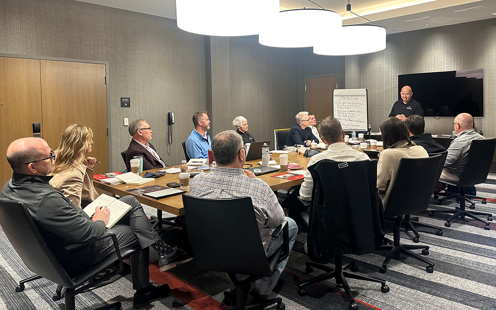 The Pinnacle team having a meeting in a conference room