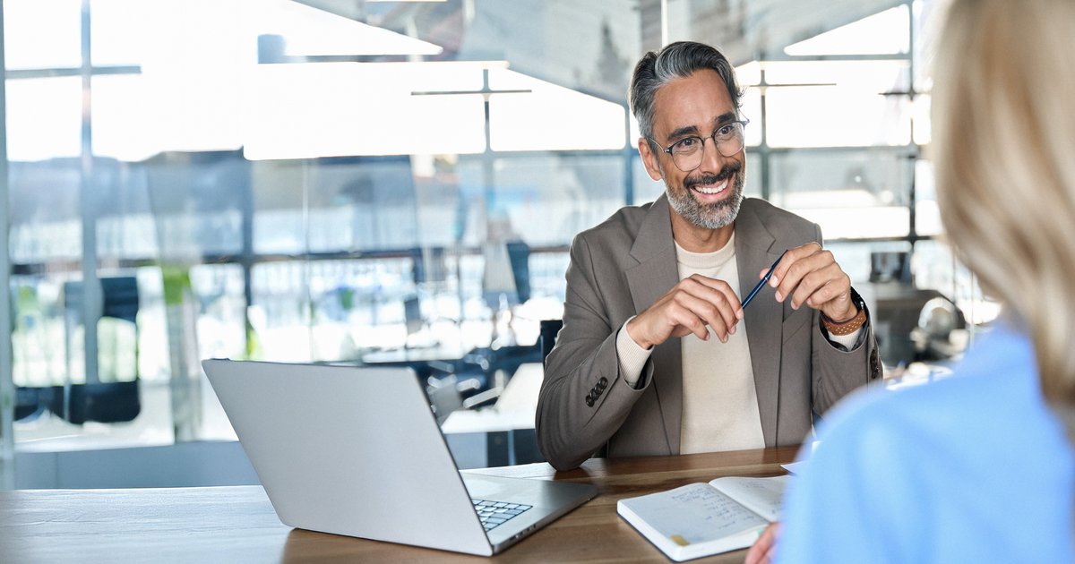 Business coach listening during a session with a company owner